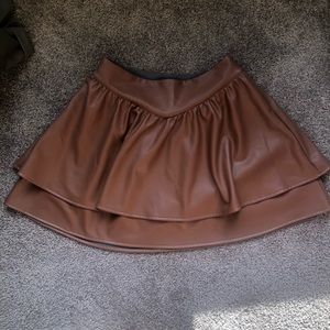 Camel faux leather express skirt (size small) with fleece lining. Brand new.